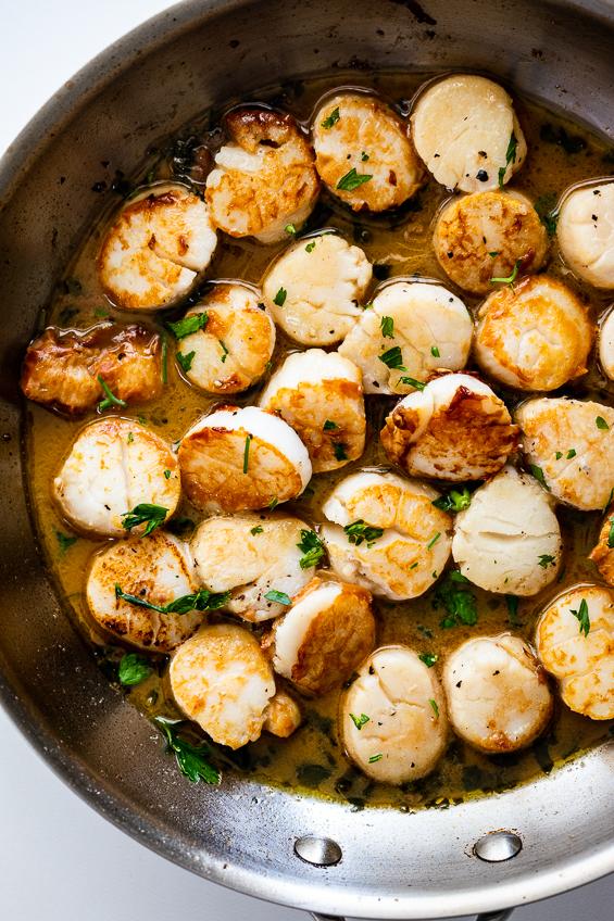  A big glass of Chardonnay pairs beautifully with these juicy scallops.
