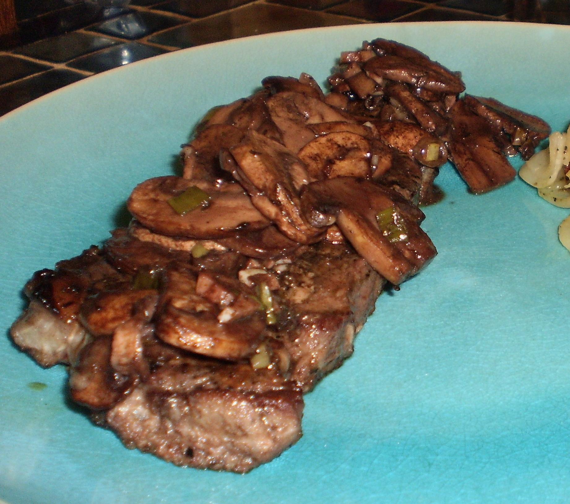  A burst of flavors in every bite of this juicy steak with a side of mushrooms cooked to perfection!