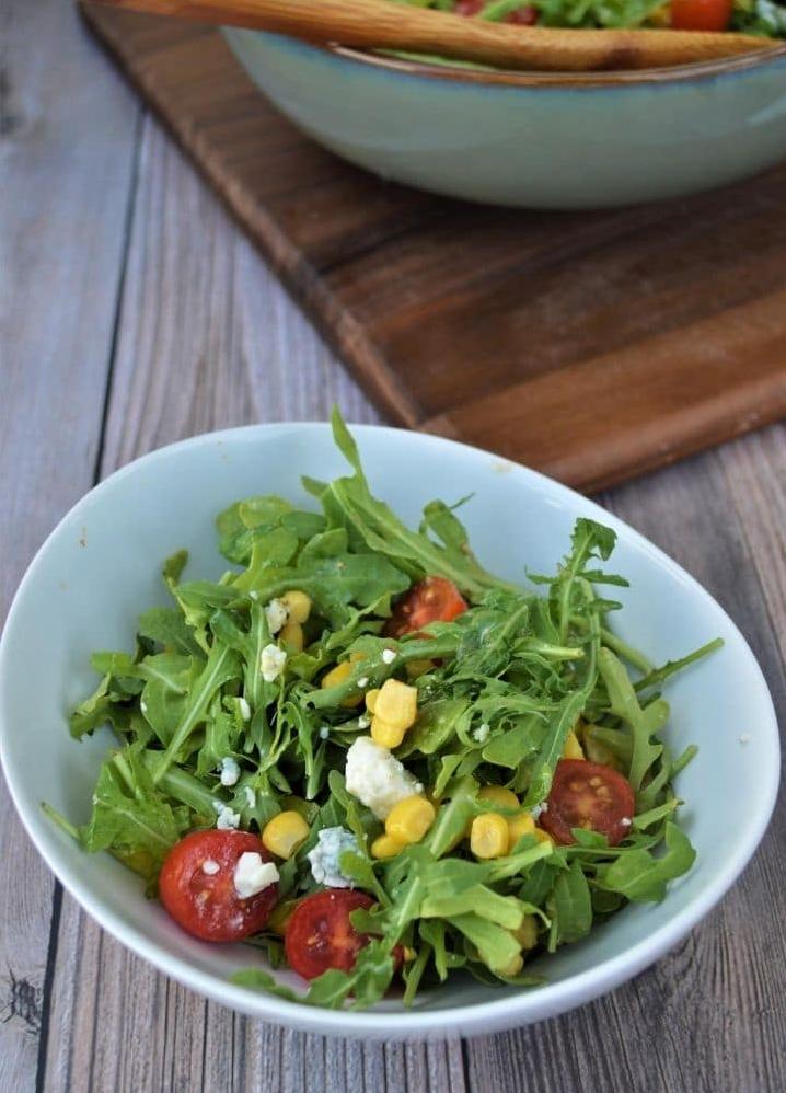  A colorful medley of fresh arugula leaves tossed with tangy wine and cheese dressing.