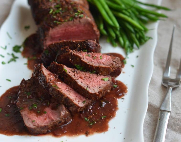  A glass of full-bodied red wine perfectly complements this decadent beef tenderloin.