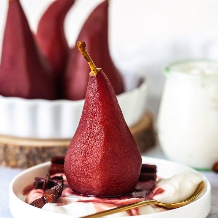  A glass of red wine in one hand, a forkful of spiced pear in the other. Heavenly.