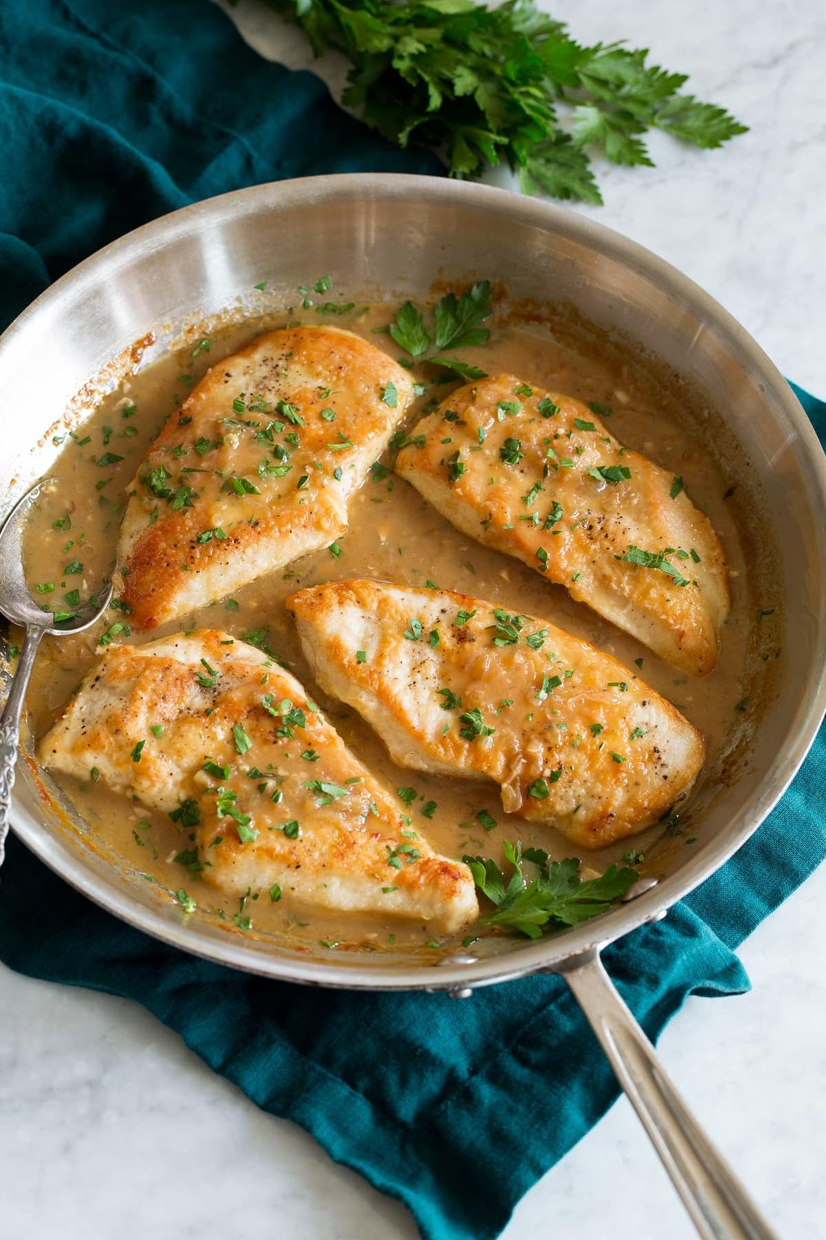  A golden-brown chicken drenched in a white wine & garlic sauce