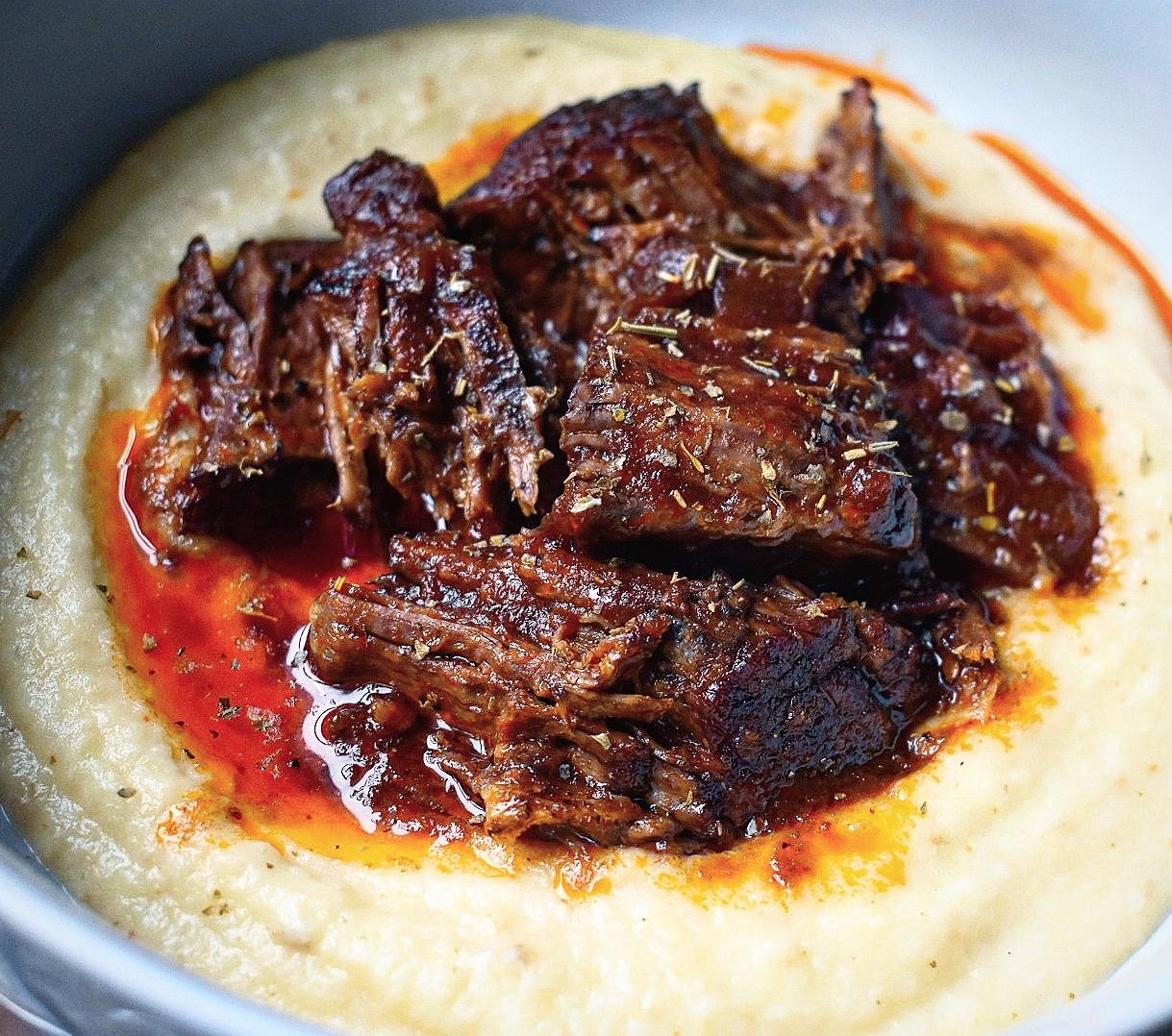  A hearty pot roast simmering in red wine goodness.