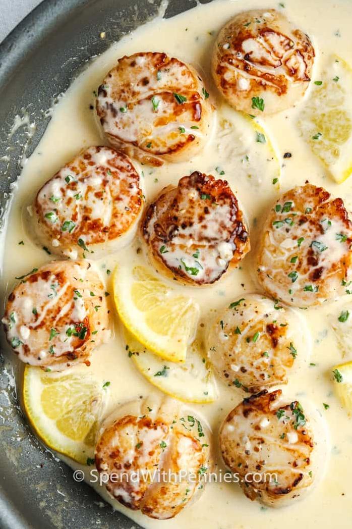  A match made in culinary heaven: succulent scallops and delicate white wine sauce.