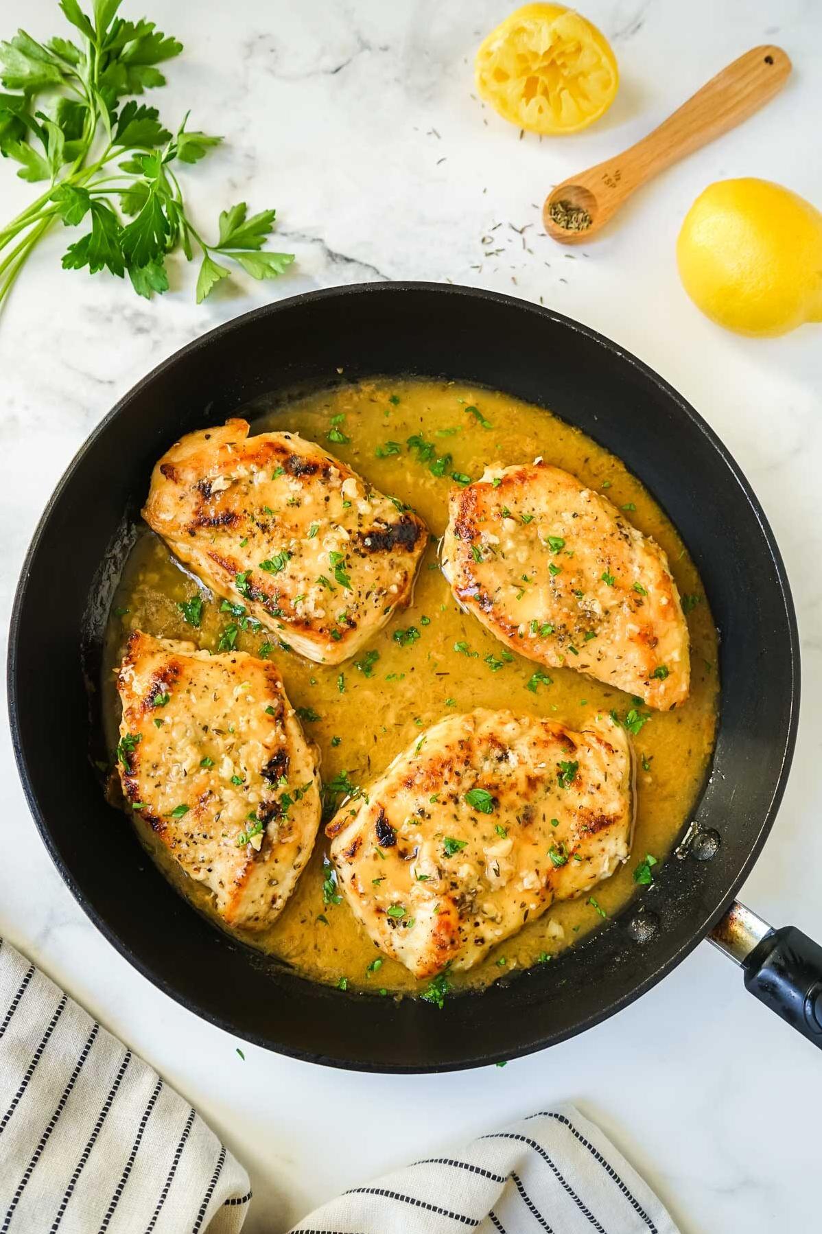  A medallion of chicken smothered in a flavorful white wine sauce.