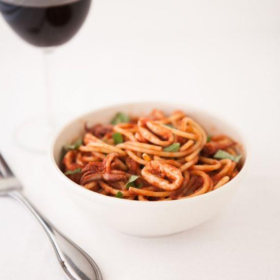  A perfect balance of tangy tomato and dry wine flavor in this calamari dish.