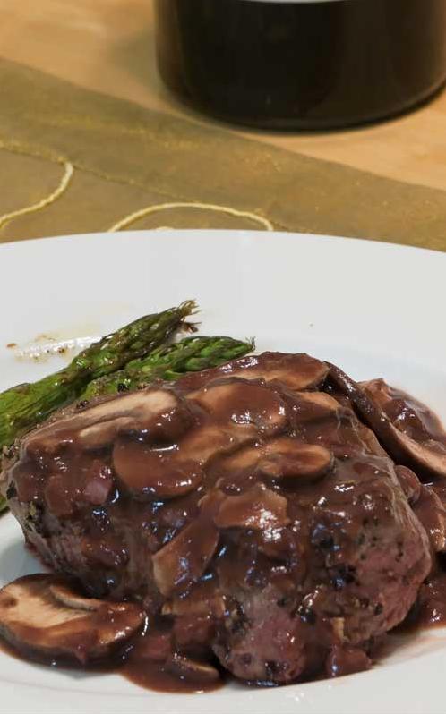  A sizzling hot plate of pepper steak with a mouth-watering port-wine mushroom sauce.