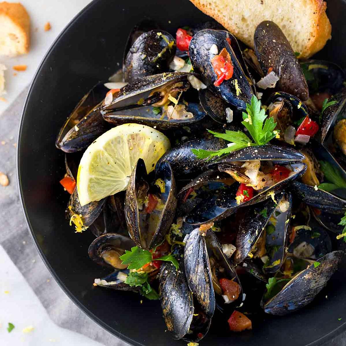  A steamy and aromatic bowl of fresh mussels in wine sauce