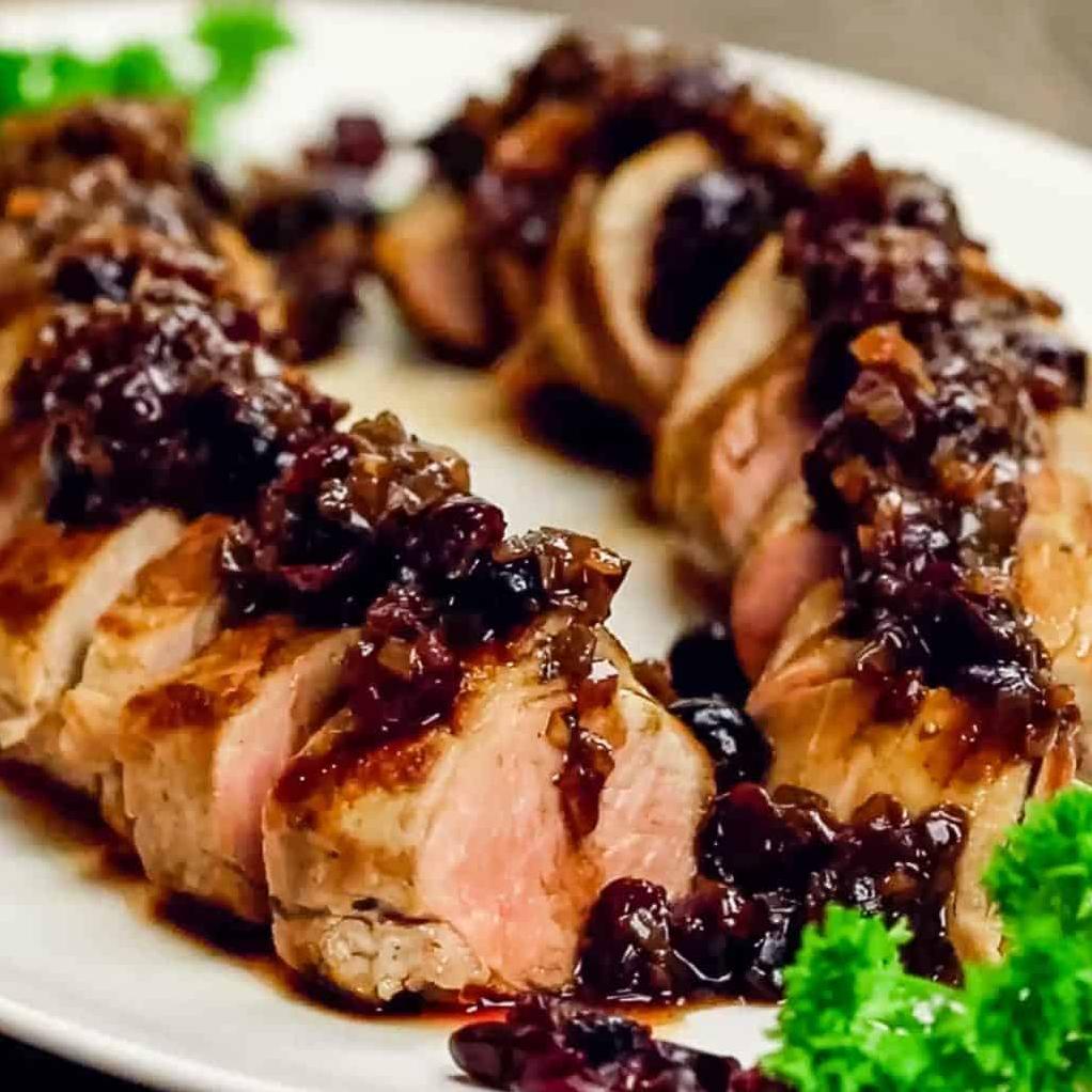  A succulent pork tenderloin coated in a rich and flavorful cranberry and Porto wine sauce.
