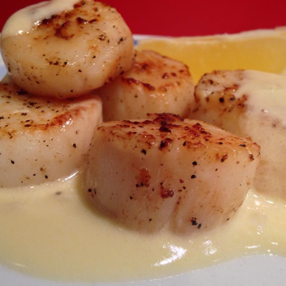  A symphony of flavor in every bite: Scallops Bonne Femme.