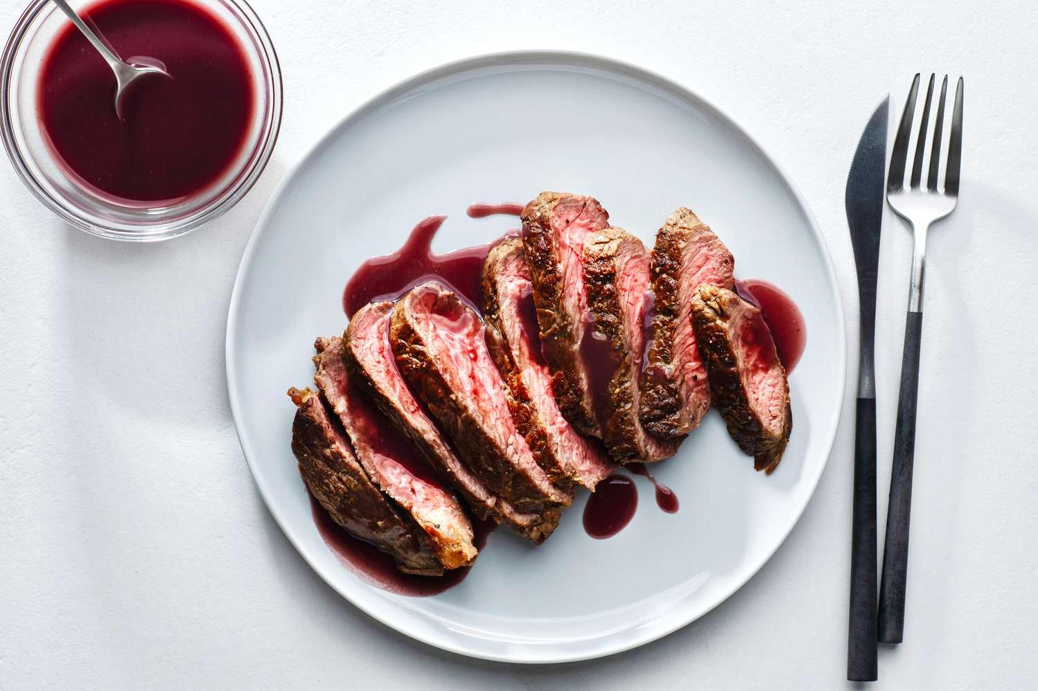  Add a pop of color and flavor to your beef dish with this vibrant red wine sauce.
