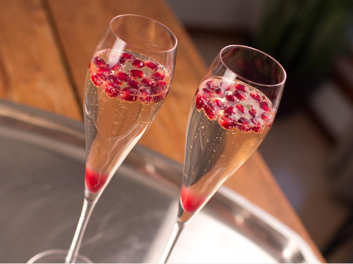  Add a sparkle to your night with this pomegranate champagne cocktail.