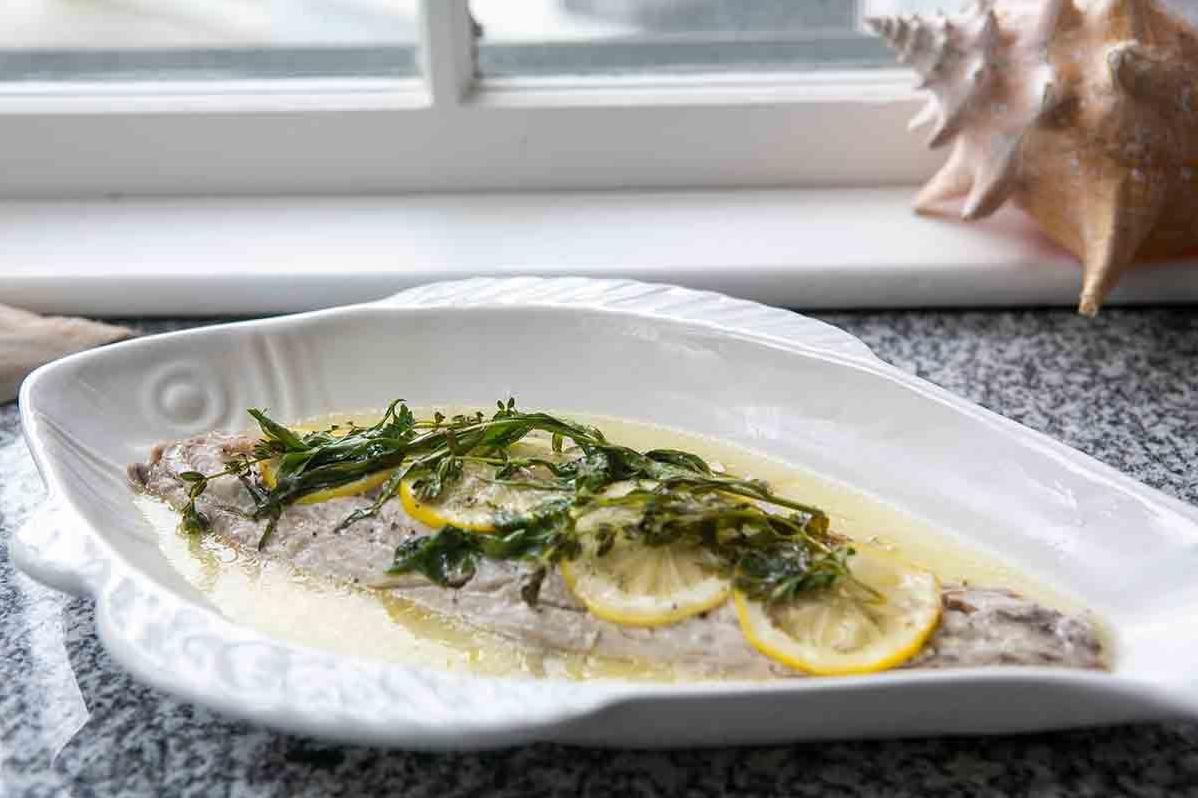  Add an extra element of elegance to your dinner table with this stunning wine-soaked baked Bluefish.