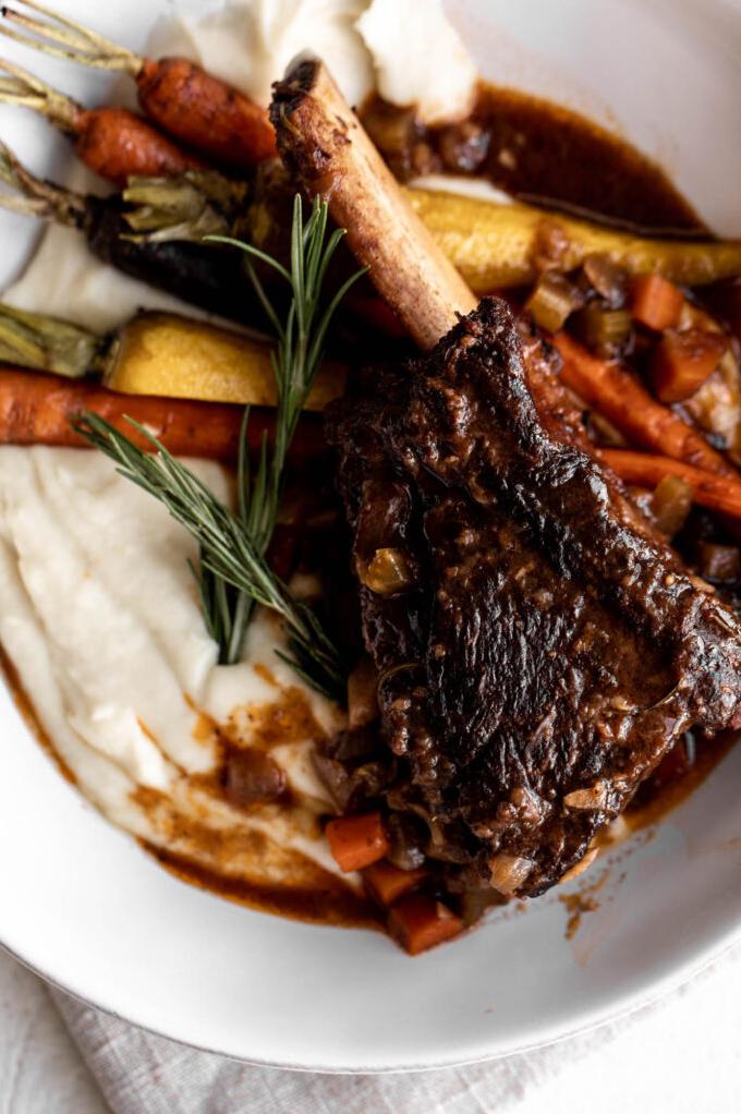  Celery root puree adds a velvety and creamy contrast to the savory beef.
