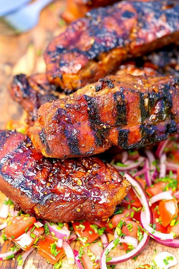  Cooking these juicy ribs low and slow over the grill will give them a smoky char and lock in the wine-infused flavor.