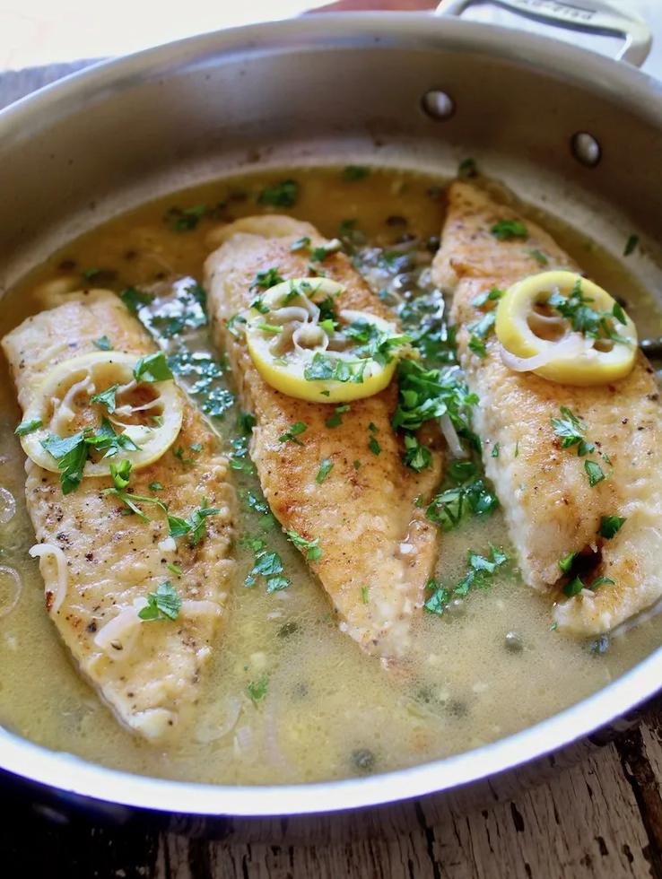  Delicate tilapia fillets dressed with a succulent white wine and caper sauce