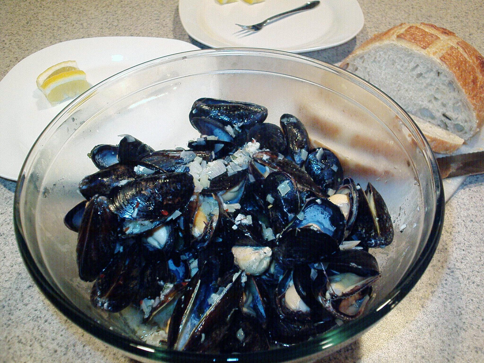  Dip your crusty bread into this savory and delicious mussels in wine broth!