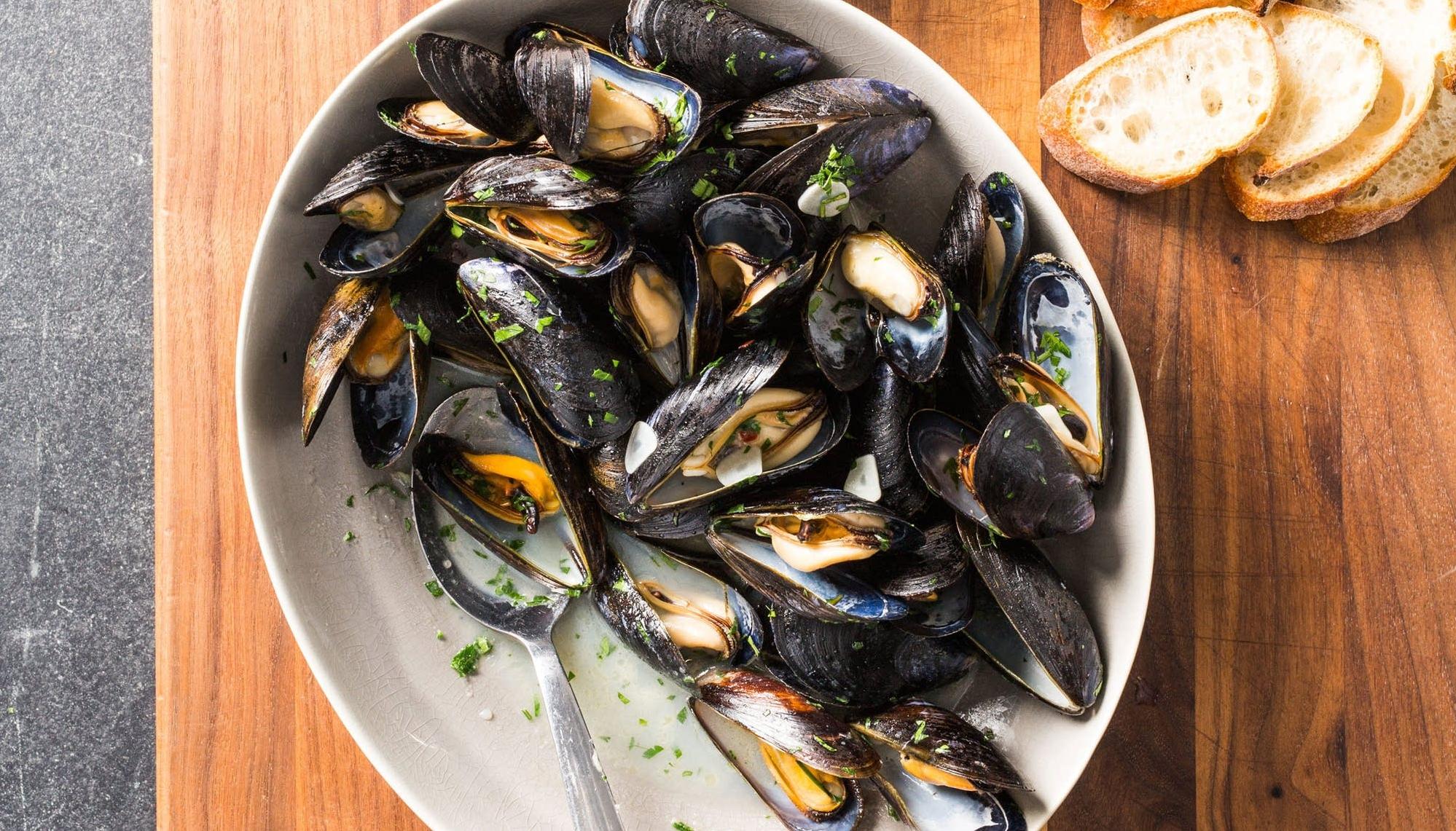  Dive in to the briny flavor of fresh bay mussels swimming in a savory white wine sauce.