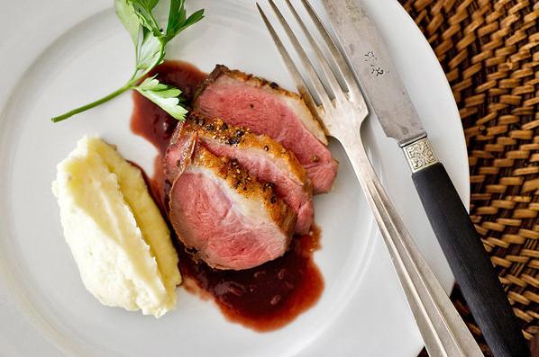 Elevate your dinner game with this mouth-watering dish of duck and wine.