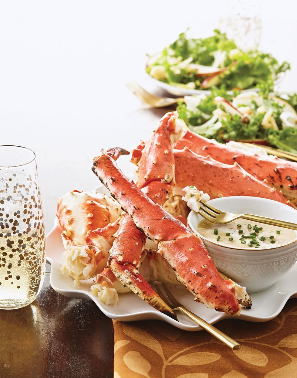  Elevate your seafood game with this mouthwatering combo of crab legs and wine.