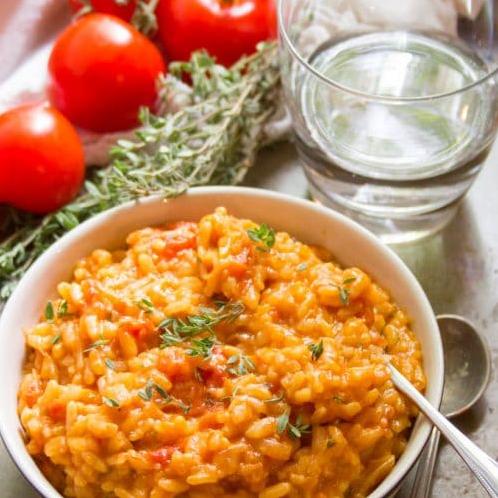  For a gourmet dinner, pair this tomato risotto with a full-bodied red wine.