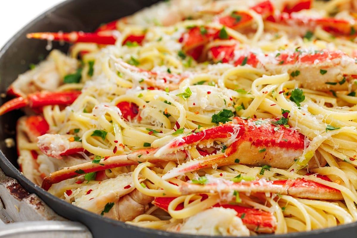  Hearty chunks of crab legs mingling harmoniously with the rich flavors of wine sauce.