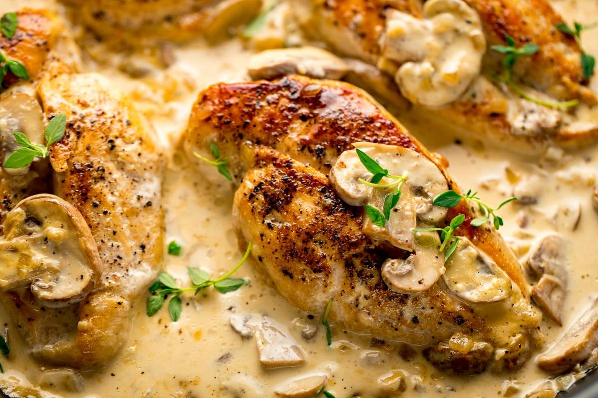  Impress dinner guests with the elegant and indulgent flavors of this chicken with wine and mushroom sauce