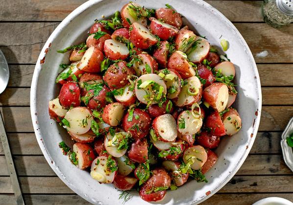  Impress your guests with this tangy twist on traditional potato salad.