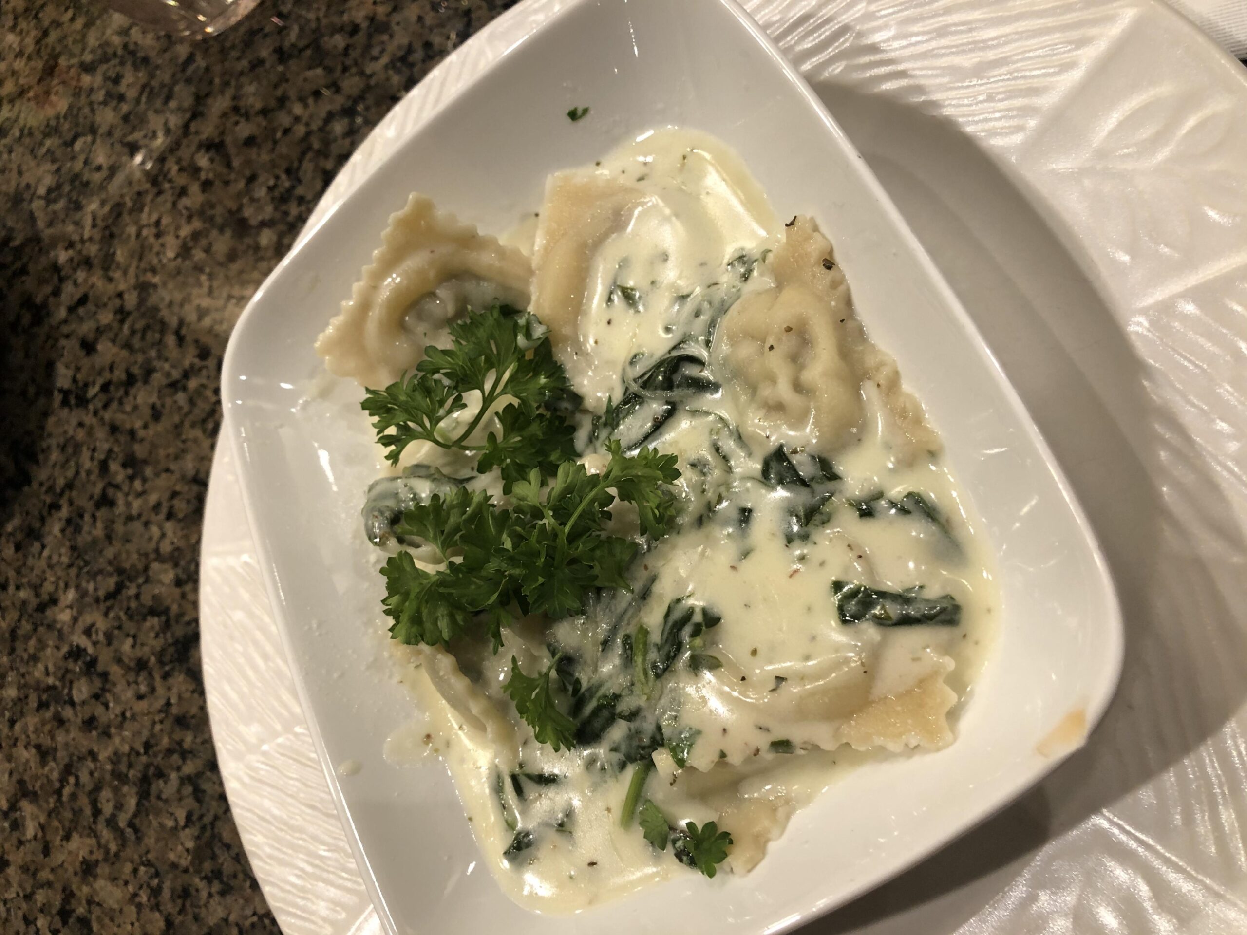  Indulge in a bowl of creamy cheese ravioli, zesty zucchini, and a refreshing white wine sauce.