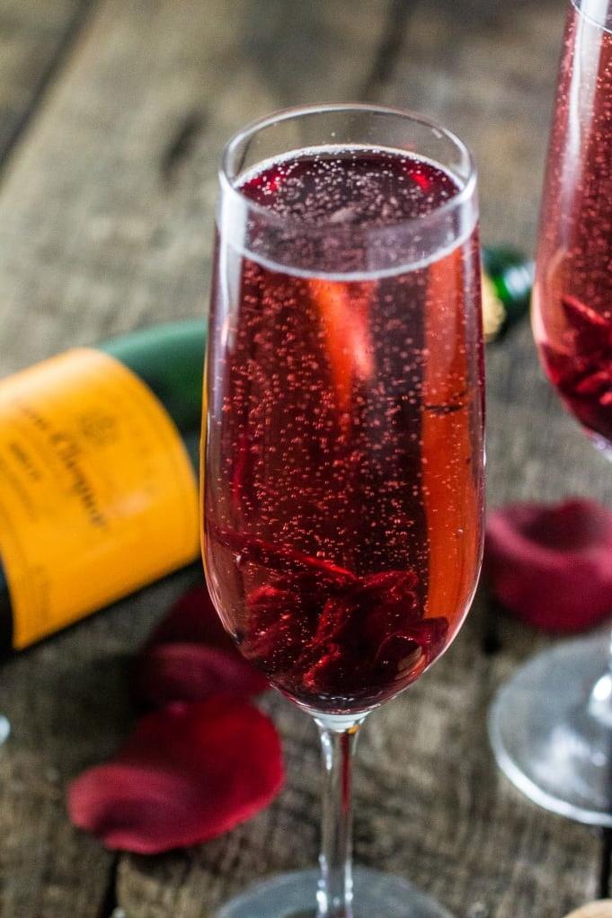  Indulge in the vibrant flavors of hibiscus mixed with the bubbly fizz of champagne.