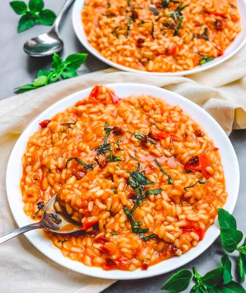  Indulge in this warm and comforting tomato risotto made with a generous glug of red wine.