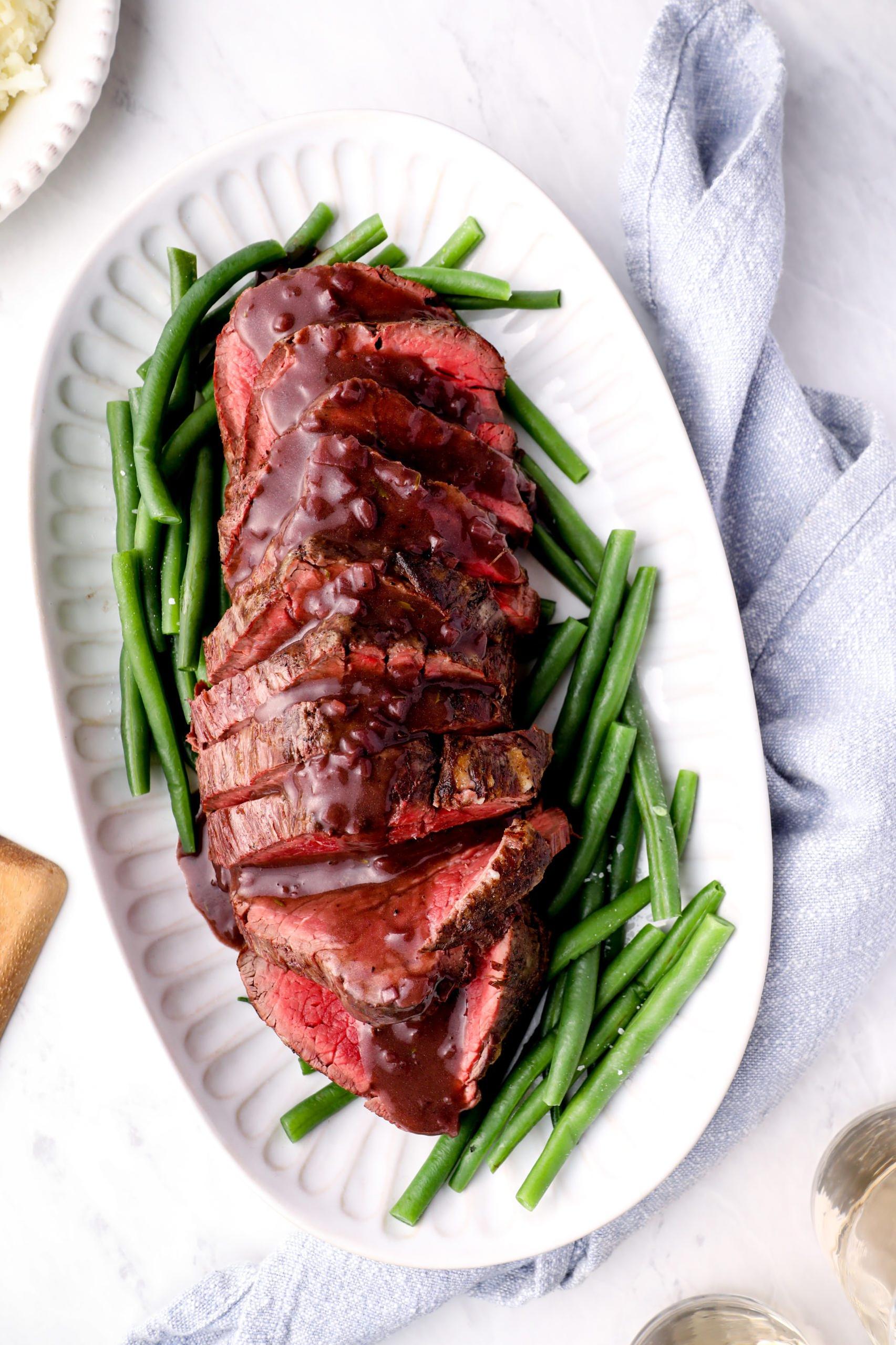  Juicy beef tenderloin drizzled with rich and savory red wine reduction.