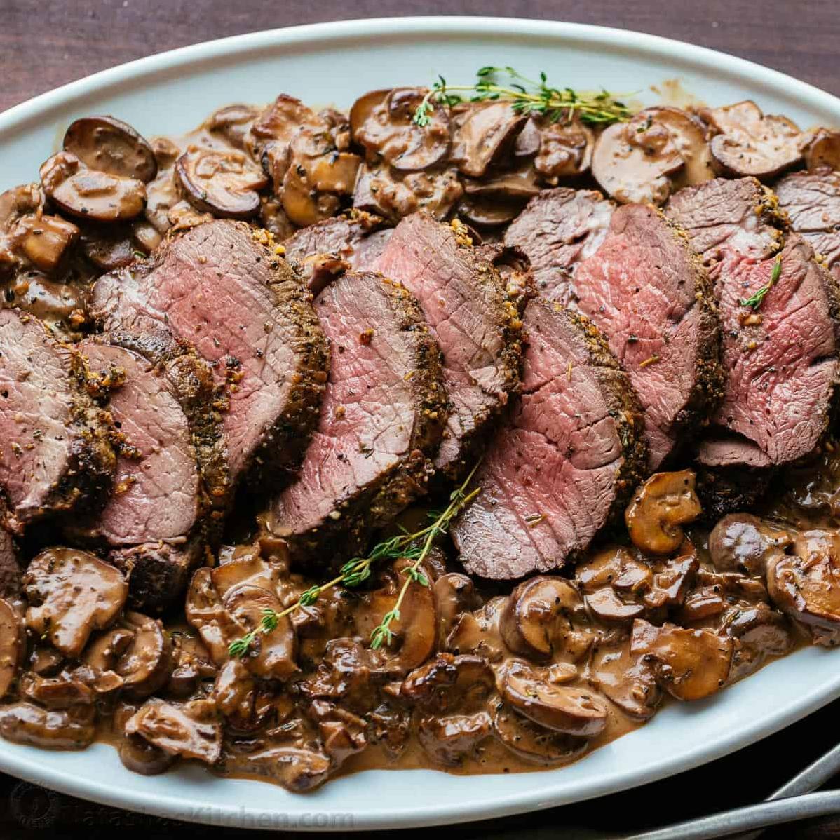  Juicy beef tenderloin steak served with sautéed mushrooms and onions, drizzled with red wine sauce.