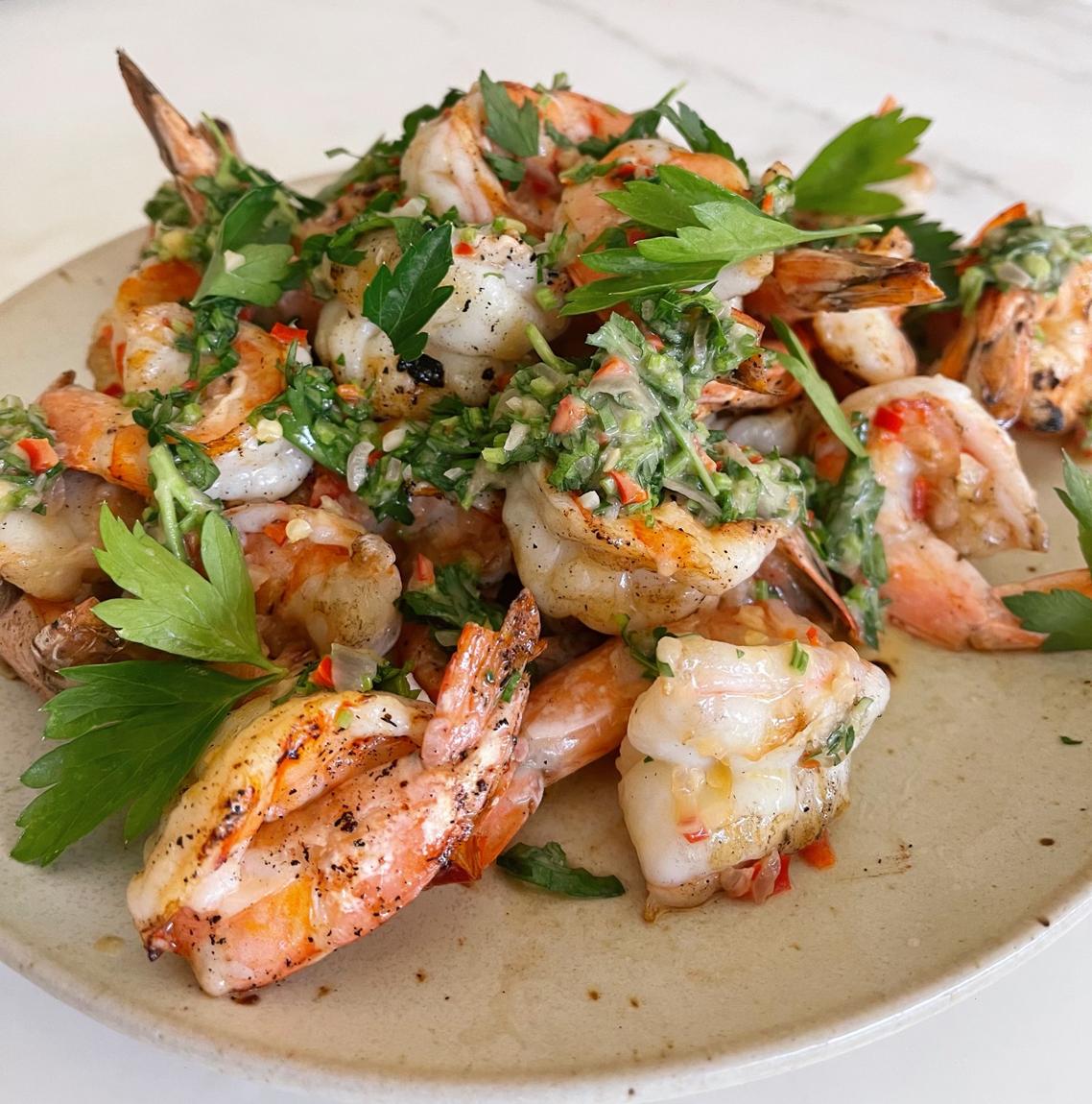  Juicy, butterflied shrimp sizzling in a flavorful wine sauce.