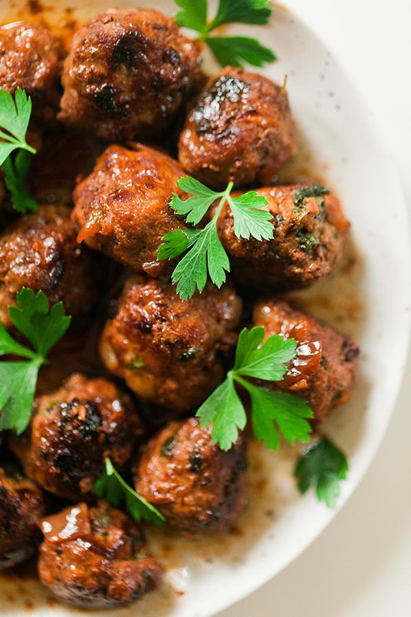  Juicy Greek meatballs swimming in a tantalizing wine sauce!