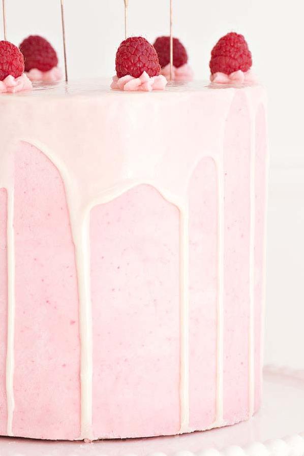  Layers of white chocolate goodness, drizzled with a fruity champagne-raspberry sauce.