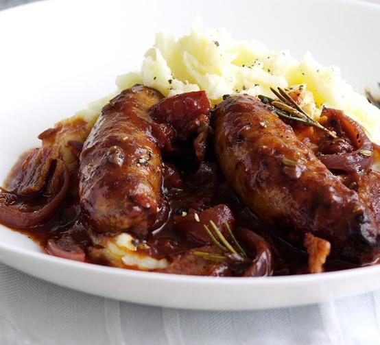  Let your taste buds embark on a journey of savory red wine and juicy sausages.