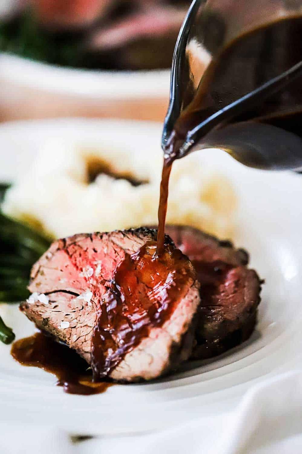  Looking for a flavorful and hearty meal? Look no further than this beef tenderloin with red wine sauce.