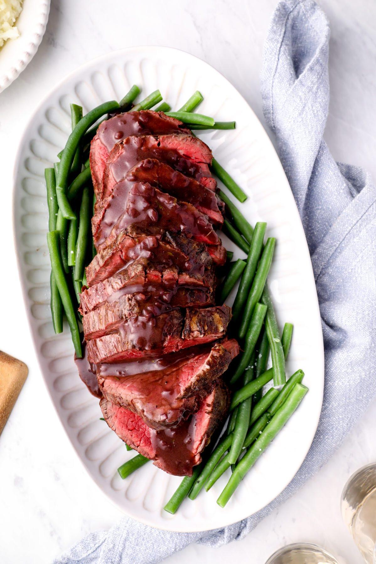  Perfectly cooked and beautifully seared beef tenderloin, served with a rich and flavorful wine sauce.