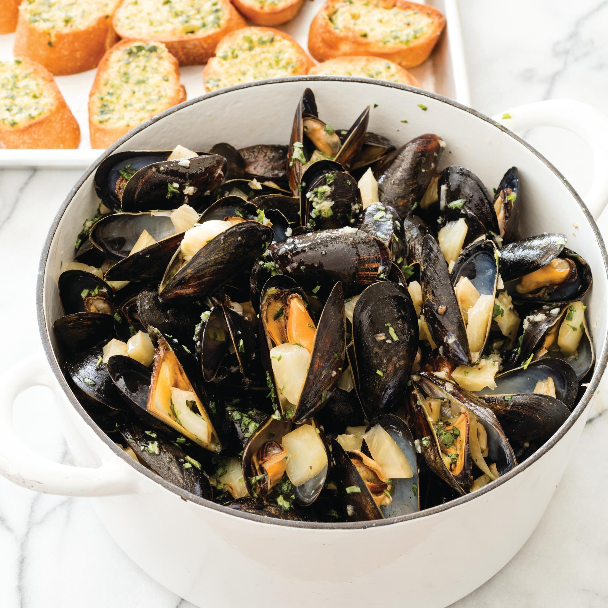  Perfectly steamed mussels resting in a pool of sophisticated white wine and garlic sauce; a delightful burst of flavor in every bite!