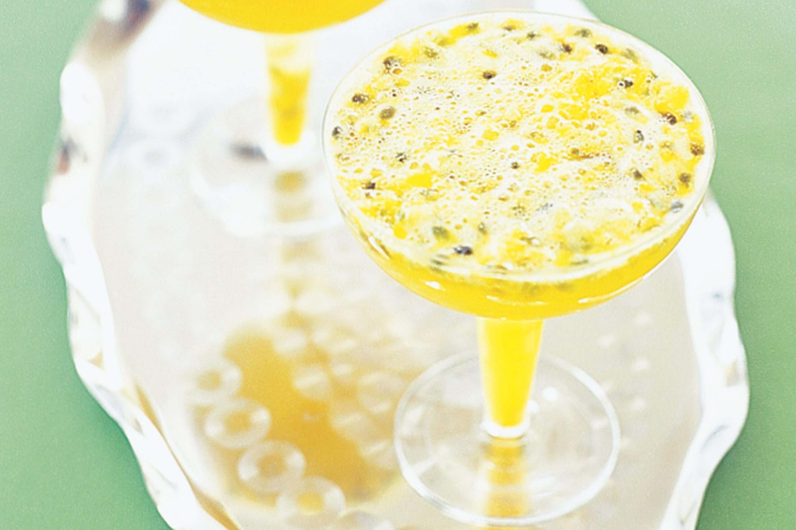  Raise a glass to the perfect summer cocktail with these vibrant passionfruit champagne cocktails!