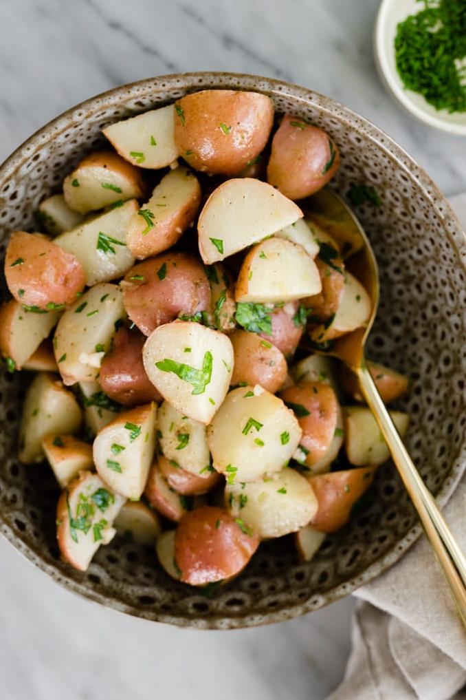  Red wine vinegar adds a unique tang to classic potato salad.