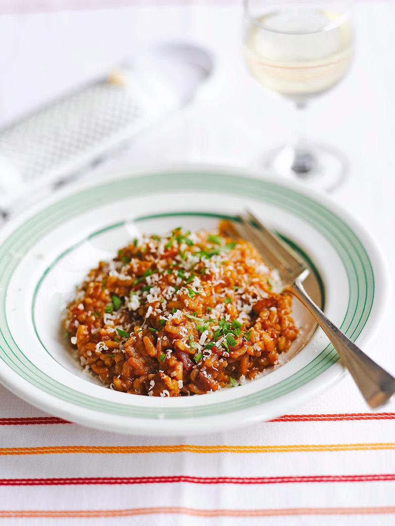  Risotto that is jam-packed with flavor and richness from tomatoes and wine.