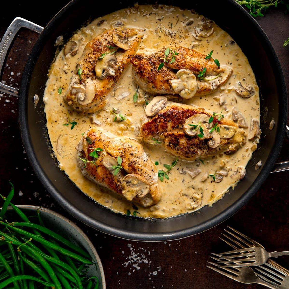  Savory chicken cooked to perfection with earthy mushrooms and white wine.