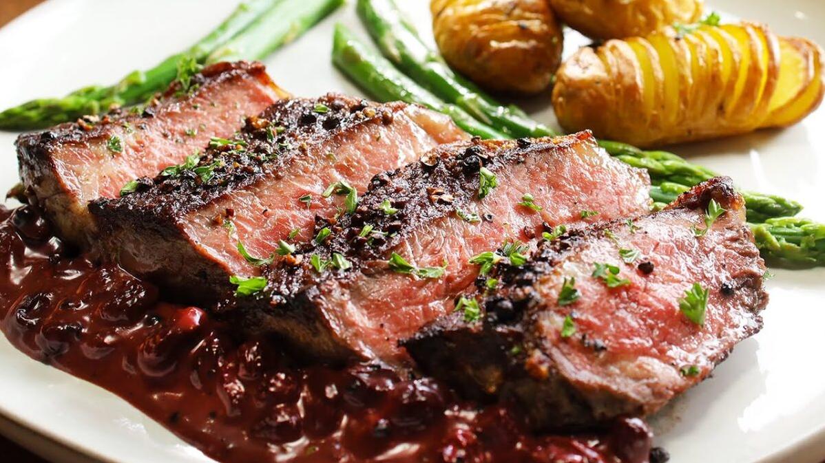  Sizzling, mouth-watering steak smothered in a rich, Cabernet sauce.