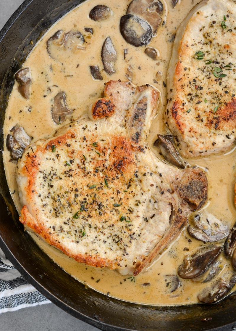  Sizzling pork chops in a savory white wine pan sauce.