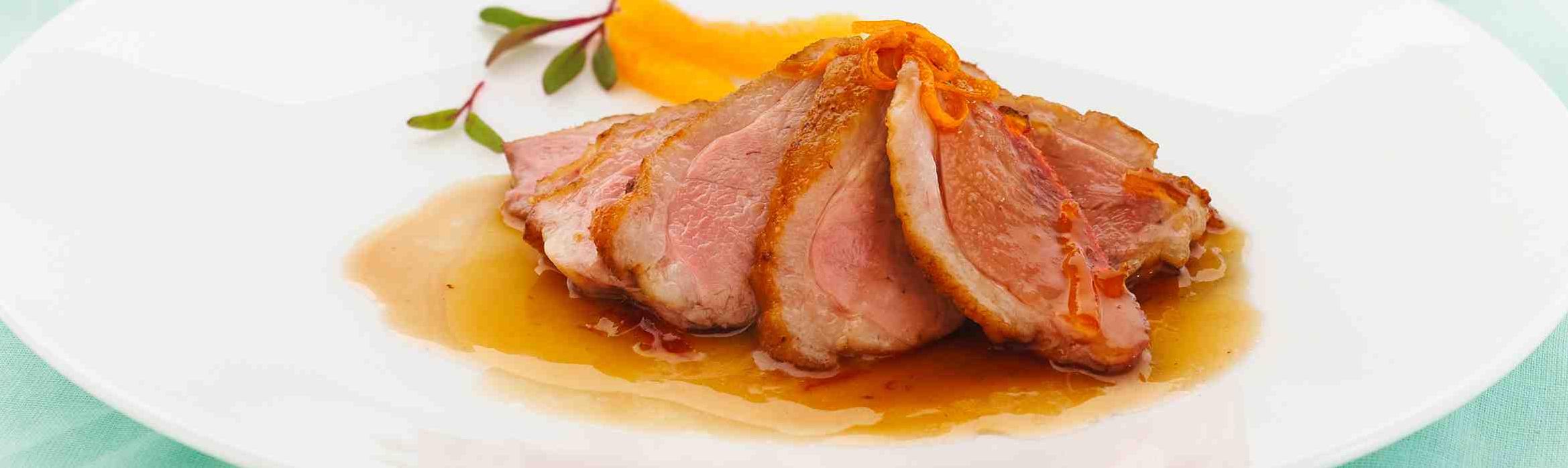  Succulent duck breasts bathing in a divine wine and marmalade sauce.