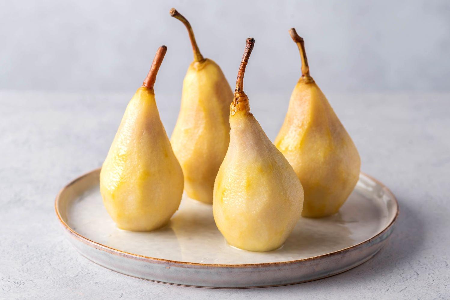  Sweet and succulent pears simmering in a white wine bath