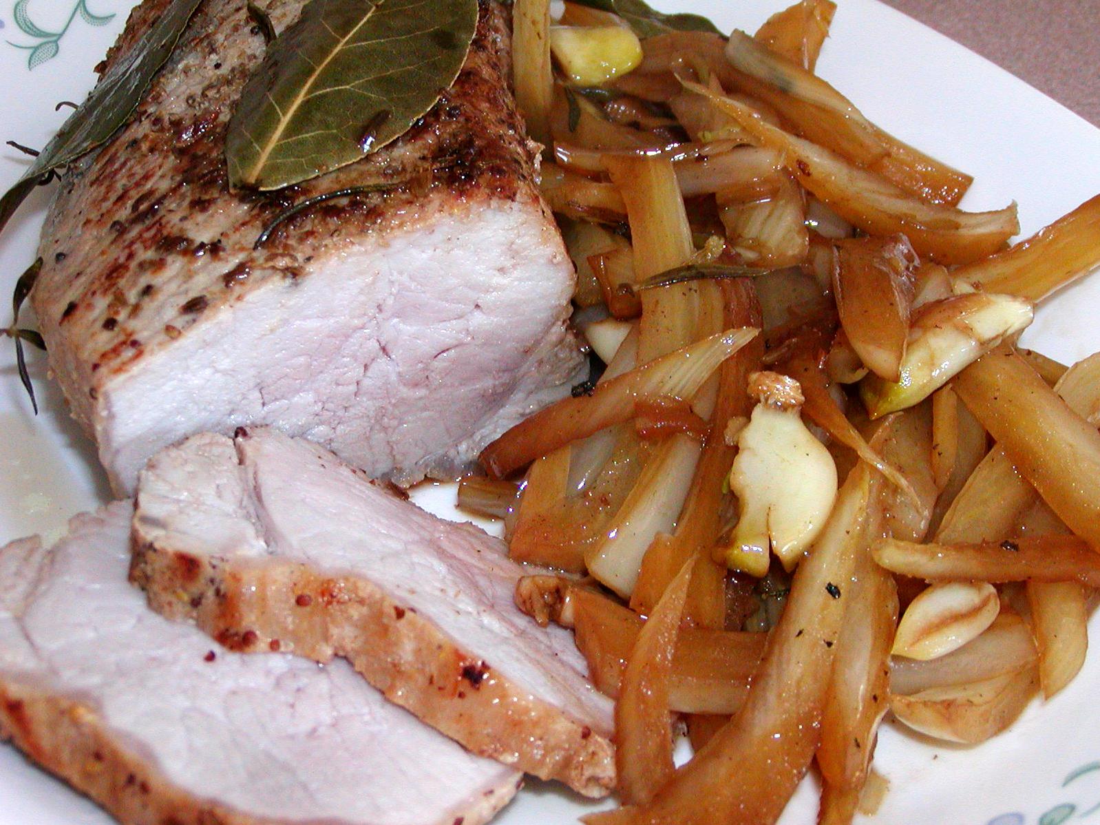  Tender pork loin cooked to perfection in a flavorful white wine sauce.