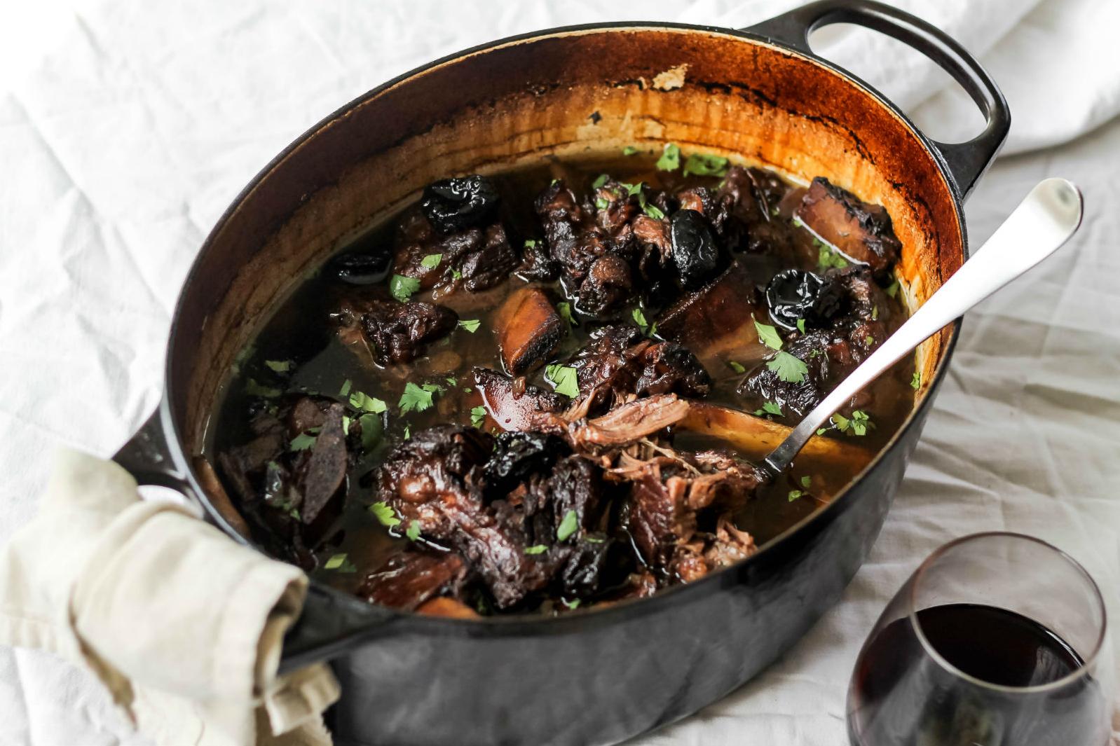  Tender short ribs cooked to perfection in a savory red wine and prune sauce
